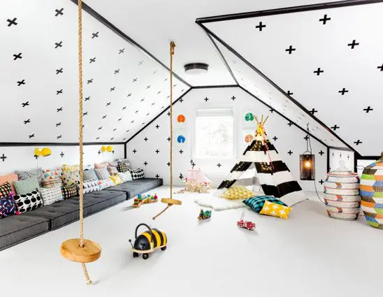 Playroom with swings and large sofa