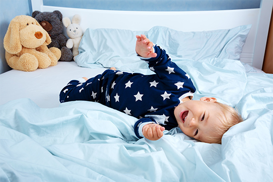 Kid jumping on bed