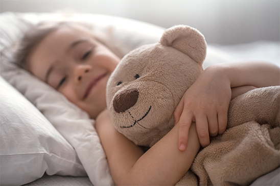 Toddler with plush toy