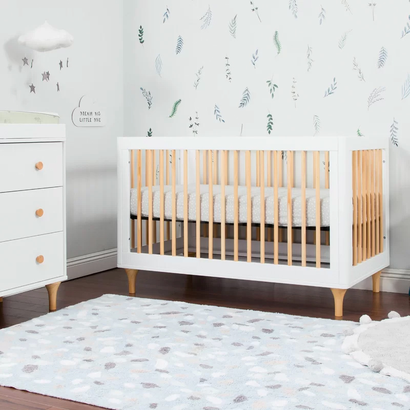 white and natural wood crib