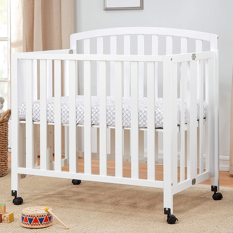 White foldable portable crib