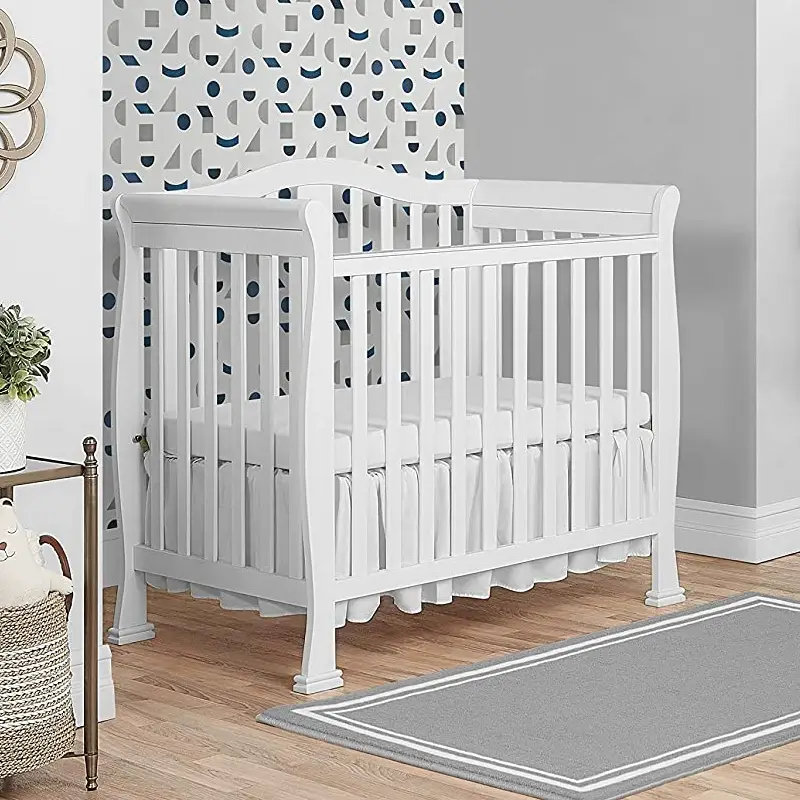 Modern White Portable Crib With Toddler Bed Conversion Kit