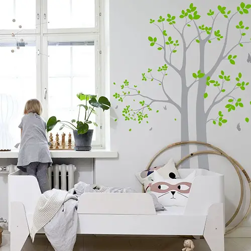 Tall tree wall decal with green leaves