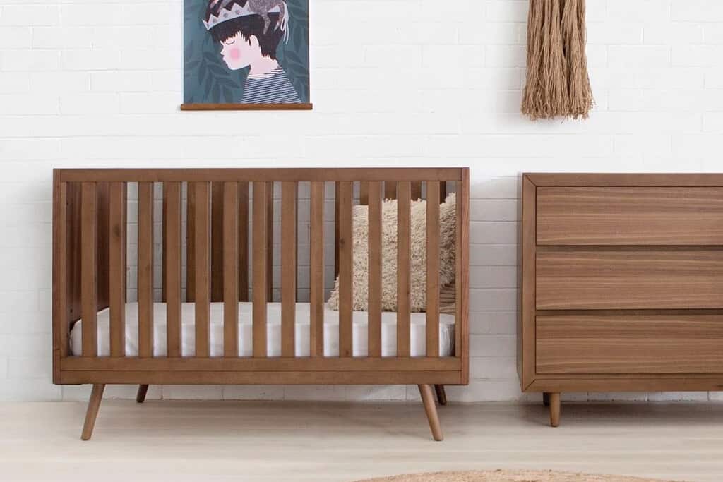 white and natural wood crib