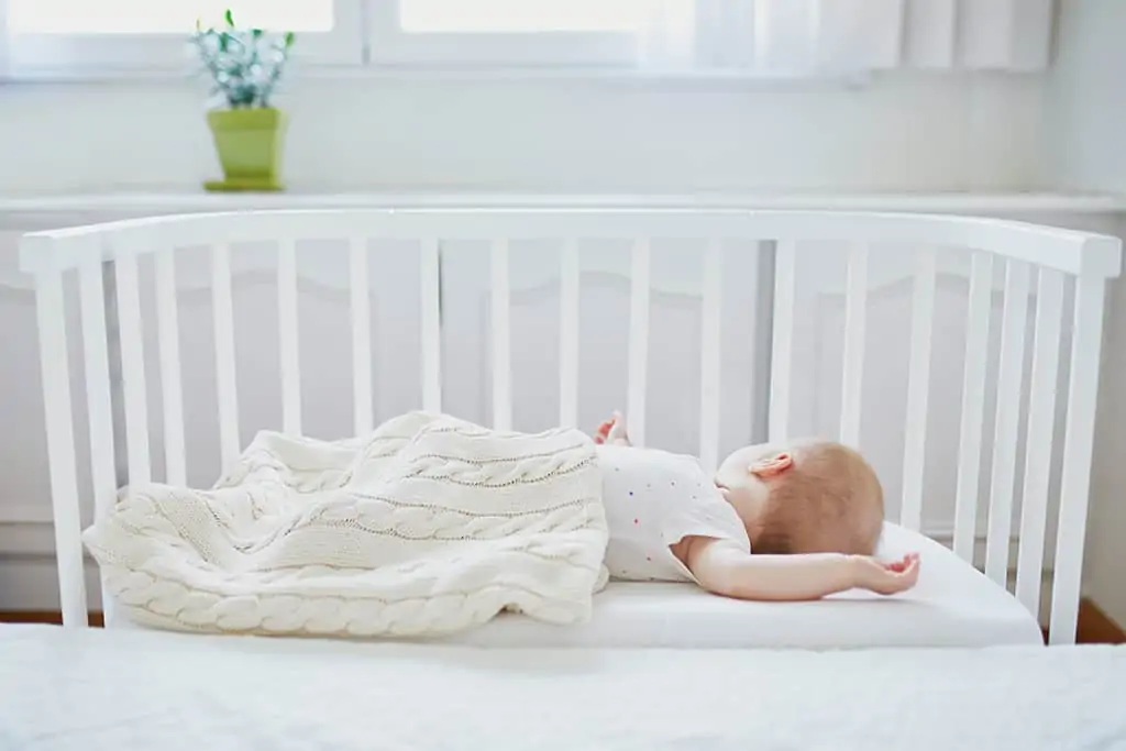 Baby sleeping in a crib