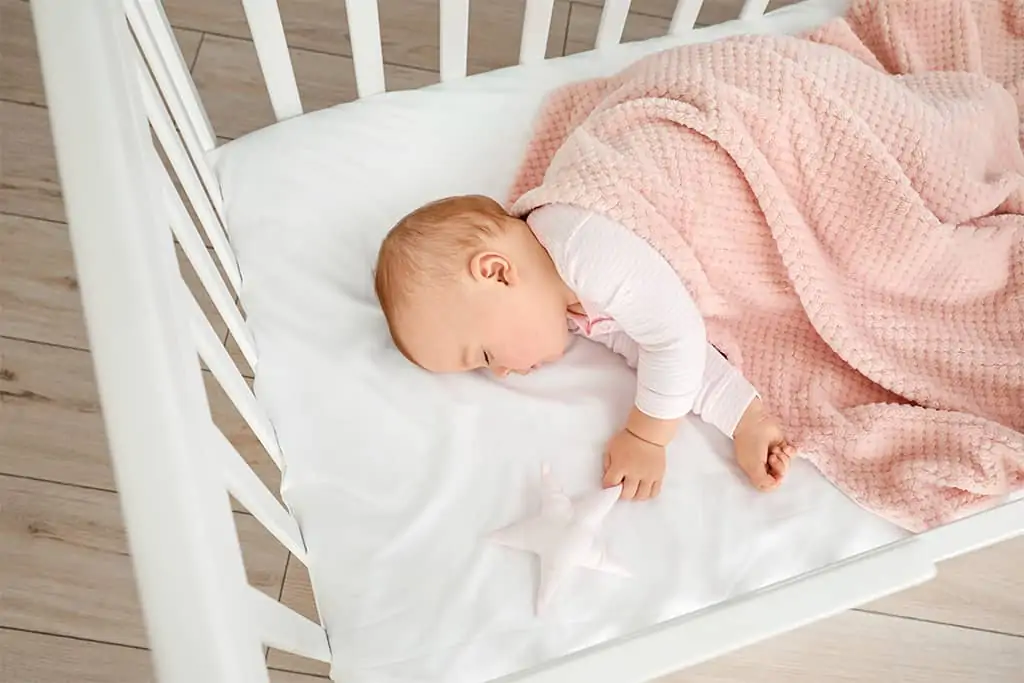 Baby sleeping in crib