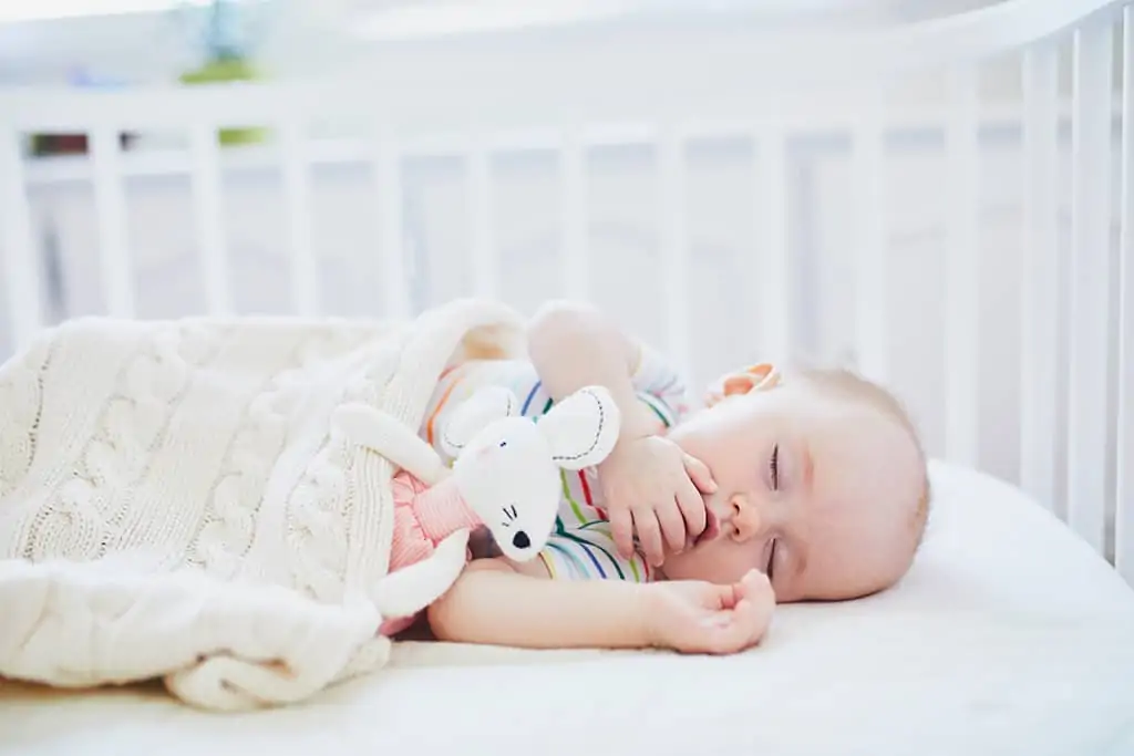 Sleeping baby in a crib